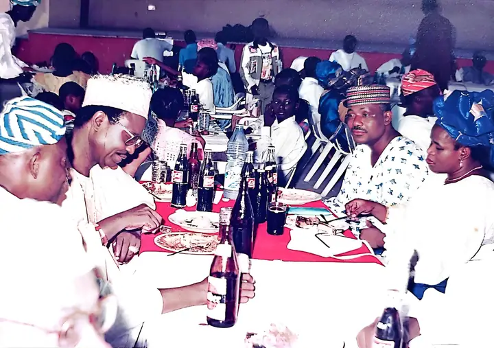 Members and guests seated around a table at a League gathering