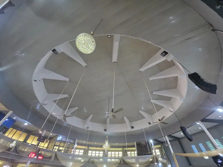 The vaulted PVC ceiling of the Cathedral with chandeliers and ceiling fans