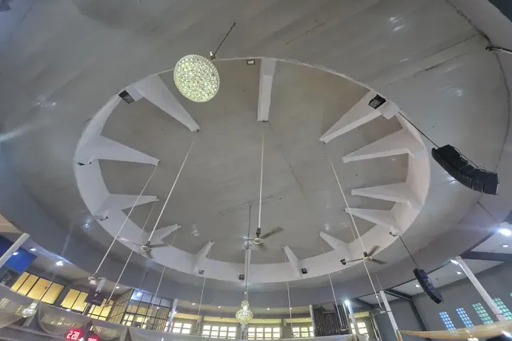 The vaulted PVC ceiling of the Cathedral with chandeliers and ceiling fans